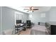 Bedroom with desk, chair, and full-size bed at 18225 W Foothill Dr, Surprise, AZ 85387