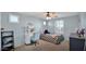 Bedroom with desk, chair, and full-size bed at 18225 W Foothill Dr, Surprise, AZ 85387