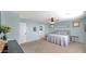Spacious bedroom with ensuite bathroom access and ceiling fan at 18225 W Foothill Dr, Surprise, AZ 85387