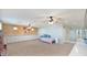 Large bonus room with built-in cabinets and two ceiling fans at 18225 W Foothill Dr, Surprise, AZ 85387