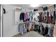 Walk-in closet with ample shelving and hanging space at 18225 W Foothill Dr, Surprise, AZ 85387