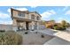 Two-story house with gray siding, a two-car garage, and a landscaped front yard at 18225 W Foothill Dr, Surprise, AZ 85387