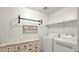 Laundry room with washer, dryer, and storage at 18225 W Foothill Dr, Surprise, AZ 85387