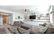 Living room with white shiplap walls and gray couches at 18225 W Foothill Dr, Surprise, AZ 85387