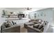 Gray couches and a white built-in entertainment center in a living room at 18225 W Foothill Dr, Surprise, AZ 85387
