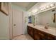 Double vanity bathroom with mirror and cabinets at 19910 N 146Th Way, Sun City West, AZ 85375