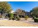 House exterior showcasing desert landscaping and a large backyard at 20802 N Grayhawk Dr # 1053, Scottsdale, AZ 85255