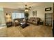 Relaxing living room, featuring leather couches and a convenient bookshelf at 23918 N 163Rd Dr, Surprise, AZ 85387