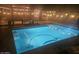 Inviting swimming pool with a spa and outdoor lighting at night at 23918 N 163Rd Dr, Surprise, AZ 85387