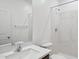 Modern bathroom boasts shower, toilet, vanity, and white marble walls at 25425 W Graham Trl, Buckeye, AZ 85326