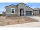 Charming single-story home boasts a well-maintained xeriscaped front yard and neutral colored stucco at 25425 W Graham Trl, Buckeye, AZ 85326