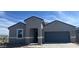 Charming single-story home boasts a well-maintained xeriscaped front yard and neutral colored stucco at 25425 W Graham Trl, Buckeye, AZ 85326