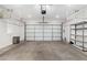 Garage with overhead storage and shelving at 2572 E Bellerive Dr, Chandler, AZ 85249