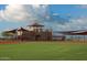 Community baseball field with covered dugouts and spectator area at 26180 W Firehawk Dr, Buckeye, AZ 85396