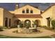 Elegant community center featuring a fountain and arched entryways at 26180 W Firehawk Dr, Buckeye, AZ 85396