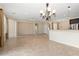 Bright dining room with tile floors and a chandelier at 26180 W Firehawk Dr, Buckeye, AZ 85396