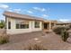 Back exterior view showing house with desert landscaping at 26180 W Firehawk Dr, Buckeye, AZ 85396