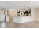 Open kitchen with granite counters and dark wood cabinets at 26180 W Firehawk Dr, Buckeye, AZ 85396