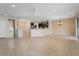 Open concept living and kitchen area with tile floors at 26180 W Firehawk Dr, Buckeye, AZ 85396
