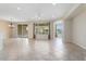 Spacious living room with tile floors and neutral color palette at 26180 W Firehawk Dr, Buckeye, AZ 85396