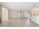 Open living area with tile flooring and access to other rooms at 26180 W Firehawk Dr, Buckeye, AZ 85396