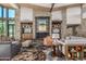 Community clubhouse with fireplace and seating area at 26180 W Firehawk Dr, Buckeye, AZ 85396