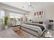 Main bedroom featuring a king-size bed and large window at 26180 W Firehawk Dr, Buckeye, AZ 85396