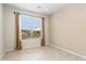 Virtually staged office features large window and tile flooring at 26180 W Firehawk Dr, Buckeye, AZ 85396