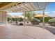 Covered patio with pergola offering shade and backyard view at 26180 W Firehawk Dr, Buckeye, AZ 85396