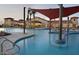 Resort-style pool with shade structures and a relaxing atmosphere at 26180 W Firehawk Dr, Buckeye, AZ 85396