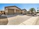 Home exterior showcasing a two-car garage and a brick driveway at 2645 N Lema Dr, Mesa, AZ 85215