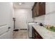 Laundry room with granite countertop and built-in cabinets at 2645 N Lema Dr, Mesa, AZ 85215