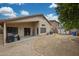 Backyard patio, covered porch, and spacious grassy area at 27413 N 23Rd Dr, Phoenix, AZ 85085