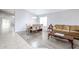 Bright dining area with wood floors and a view into the living room at 27413 N 23Rd Dr, Phoenix, AZ 85085