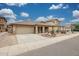 Single-story home with desert landscaping and a two-car garage at 27413 N 23Rd Dr, Phoenix, AZ 85085