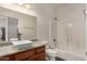 Bathroom with granite countertop, modern sink, and tub at 2950 W Louise Dr # 204, Phoenix, AZ 85027