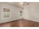 Spacious bedroom with wood-look floors and dual windows at 2950 W Louise Dr # 204, Phoenix, AZ 85027