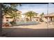 Inviting backyard oasis with a sparkling pool and water feature at 3410 N 131St Ln, Litchfield Park, AZ 85340
