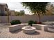 Relaxing backyard firepit area with built-in seating at 3410 N 131St Ln, Litchfield Park, AZ 85340