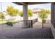 Spacious backyard patio with pavers, a gate, and a view of the grassy area at 3410 N 131St Ln, Litchfield Park, AZ 85340