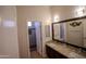 Bathroom boasts double sinks, granite counters, and a separate shower at 3410 N 131St Ln, Litchfield Park, AZ 85340