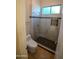 Clean bathroom with a glass-enclosed shower and tile flooring at 3410 N 131St Ln, Litchfield Park, AZ 85340