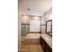 Spa-like bathroom with soaking tub, walk-in shower, and granite vanity at 3410 N 131St Ln, Litchfield Park, AZ 85340