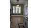 Bright dining area with light tile floors and a stylish light fixture at 3410 N 131St Ln, Litchfield Park, AZ 85340