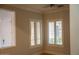 Dining room features plantation shutters and tile flooring at 3410 N 131St Ln, Litchfield Park, AZ 85340