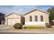Two-story house with a two-car garage and manicured lawn at 3410 N 131St Ln, Litchfield Park, AZ 85340