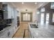 Modern kitchen featuring granite countertops and stainless steel appliances at 3410 N 131St Ln, Litchfield Park, AZ 85340
