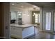 Modern kitchen with island, granite counters, and stainless steel appliances at 3410 N 131St Ln, Litchfield Park, AZ 85340