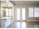 Bright kitchen with island, granite countertops and view to backyard at 3410 N 131St Ln, Litchfield Park, AZ 85340