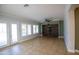 Spacious living room with stone feature wall and tiled floors at 3410 N 131St Ln, Litchfield Park, AZ 85340